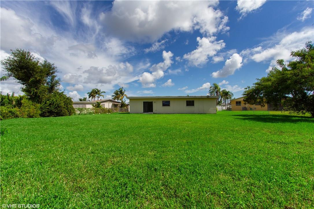 11398 Southwest 227th Terrace Miami, FL 33170 - Photo 13 of 13 a front view of a house with garden