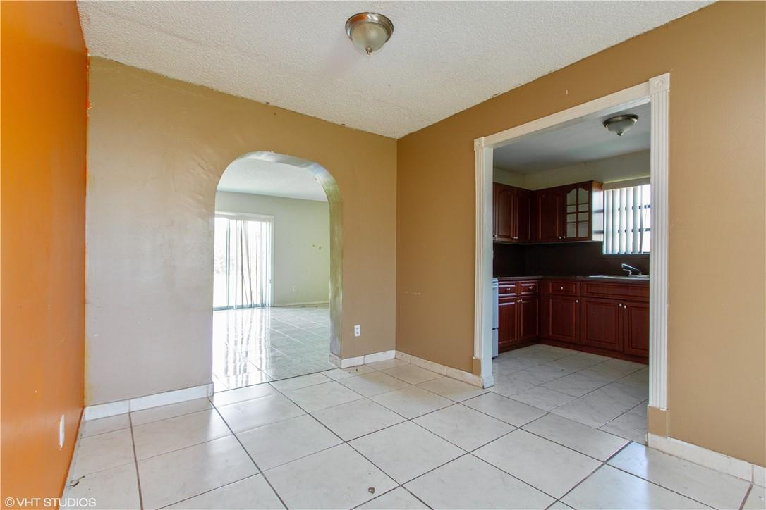 11398 Southwest 227th Terrace Miami, FL 33170 - Photo 3 of 13 a view of an empty room and window