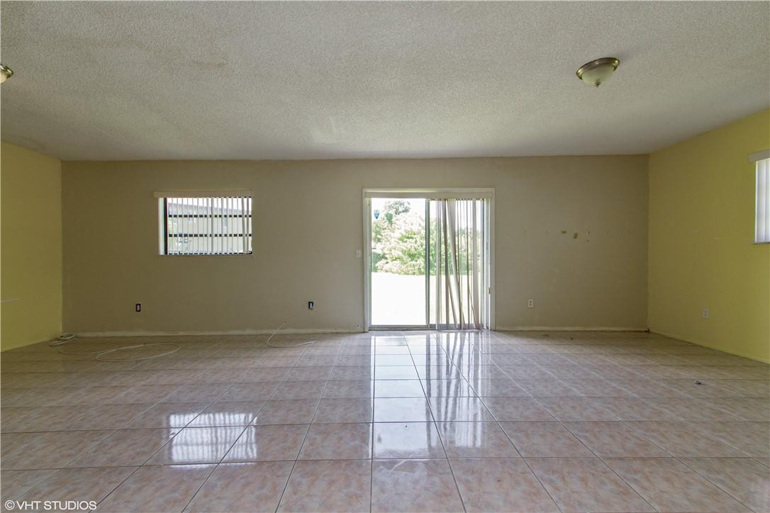 11398 Southwest 227th Terrace Miami, FL 33170 - Photo 4 of 13 a view of an empty room and window