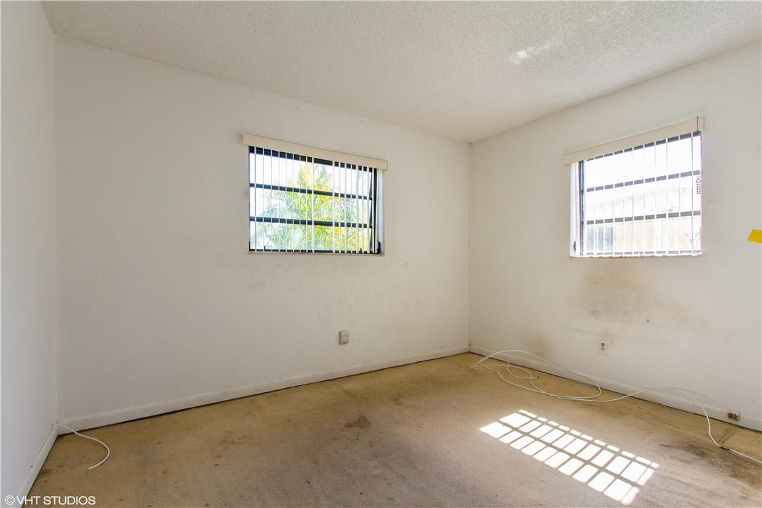 11398 Southwest 227th Terrace Miami, FL 33170 - Photo 8 of 13 an empty room with windows