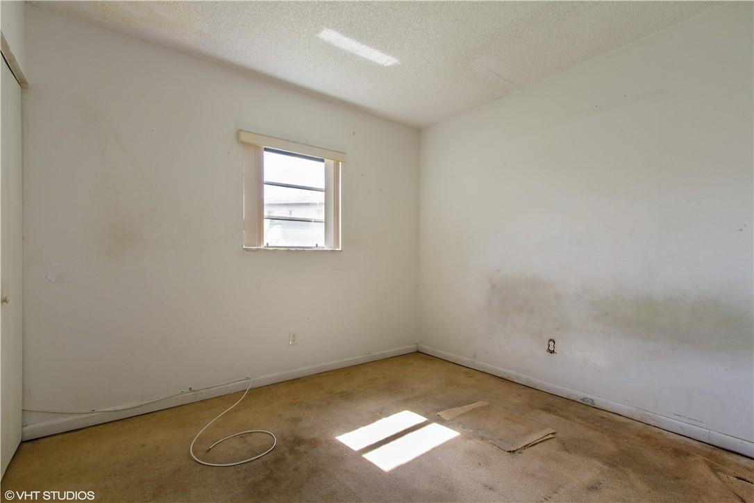 11398 Southwest 227th Terrace Miami, FL 33170 - Photo 9 of 13 an empty room with windows