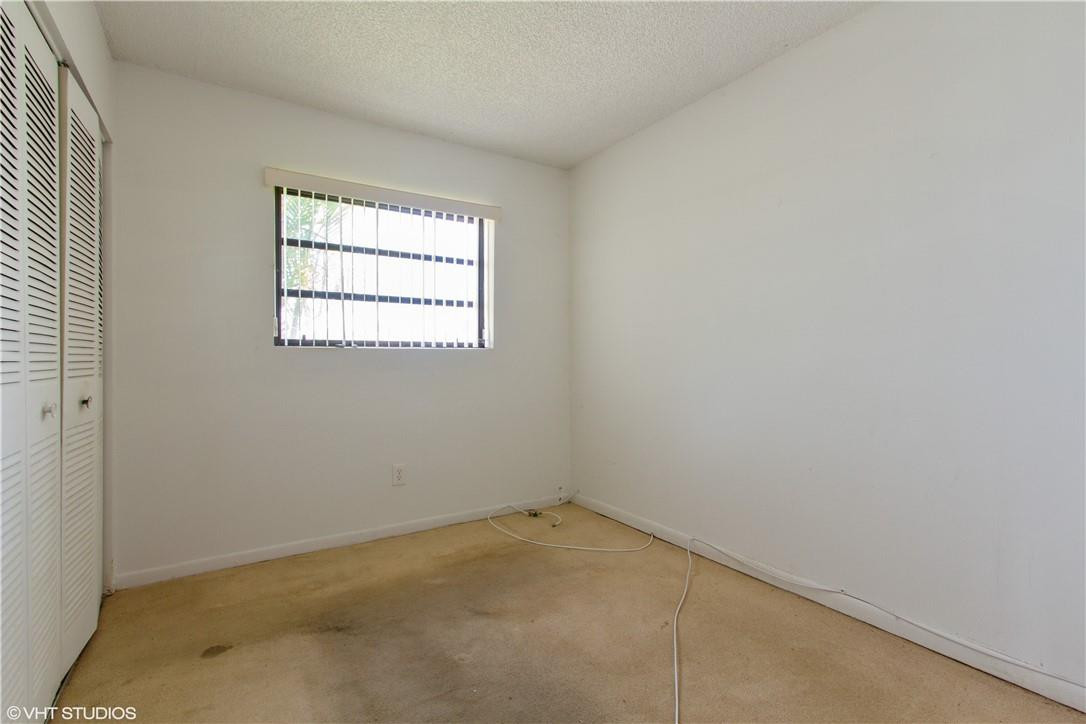 11398 Southwest 227th Terrace Miami, FL 33170 - Photo 10 of 13 an empty room with a window