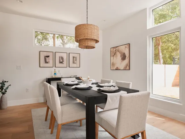 a dining room with furniture and window
