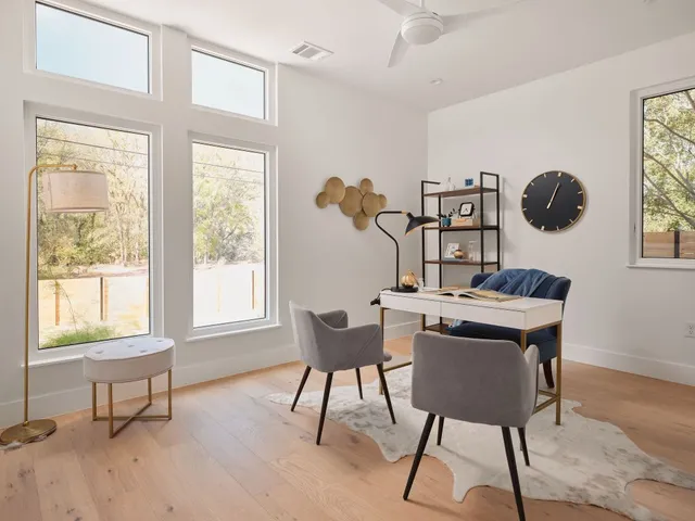 a work room with furniture and windows