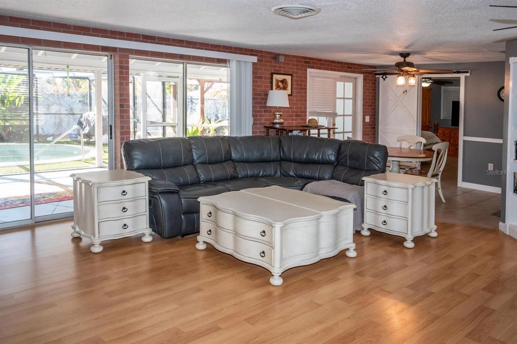 3465 Gulf Lane Rotonda West, FL 33947 - Photo 14 of 42 a living room with furniture and a large window