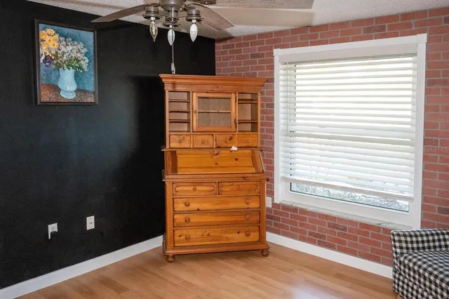 wooden floor in an empty room and a window
