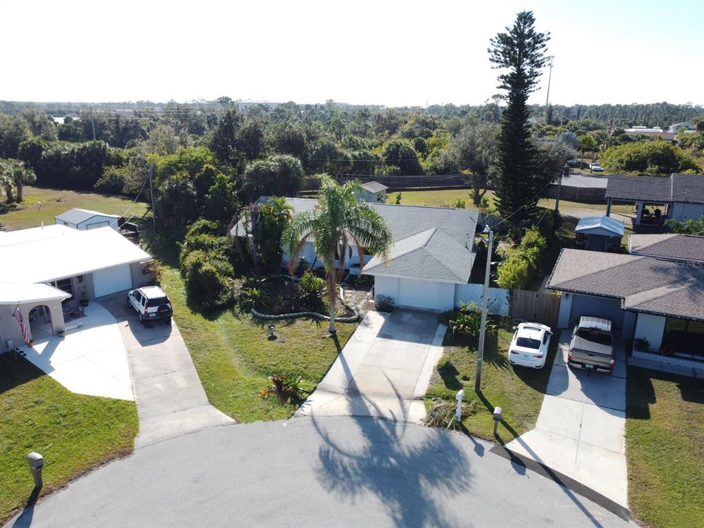 3465 Gulf Lane Rotonda West, FL 33947 - Photo 3 of 42 a view of a house with pool and a view of a swimming pool