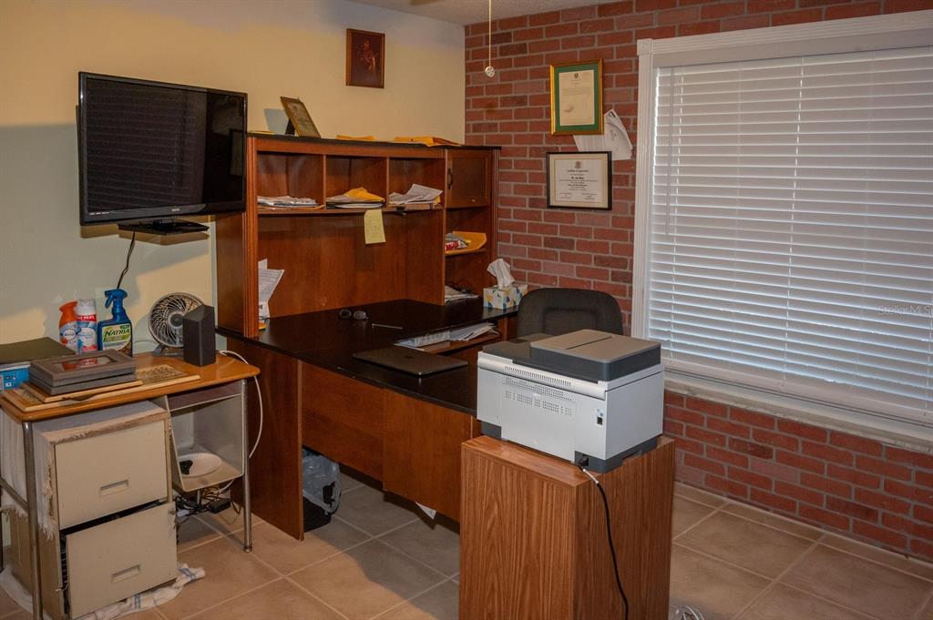 3465 Gulf Lane Rotonda West, FL 33947 - Photo 32 of 42 a kitchen with stainless steel appliances granite countertop a sink stove and cabinets