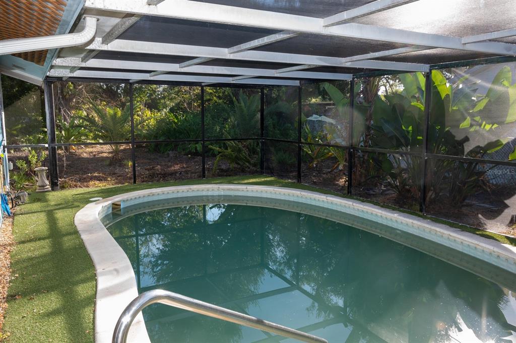 3465 Gulf Lane Rotonda West, FL 33947 - Photo 38 of 42 a view of a swimming pool with a porch