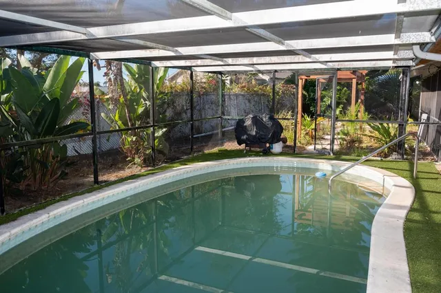 a view of swimming pool from a balcony