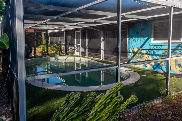 a view of a chair and table in the patio