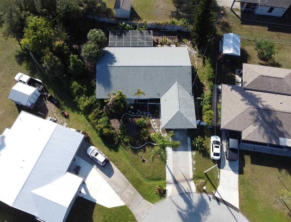 3465 Gulf Lane Rotonda West, FL 33947 - Photo 4 of 42 an aerial view of a house with swimming pool and garden