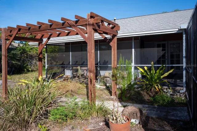 a view of a chair and table in the garden