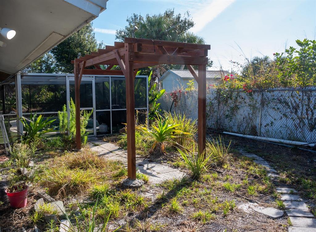 3465 Gulf Lane Rotonda West, FL 33947 - Photo 42 of 42 a view of a chair and table in the garden