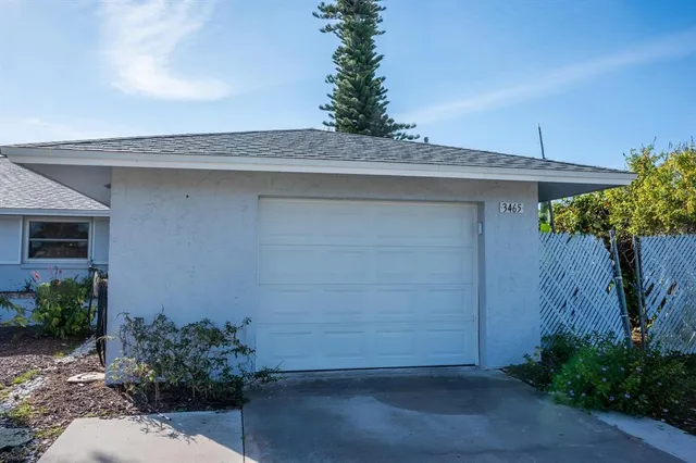a couple of potted plants in front of door