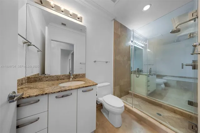 a kitchen with stainless steel appliances granite countertop wooden cabinets a sink and dishwasher