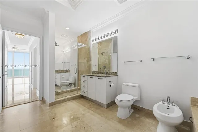 a kitchen with stainless steel appliances granite countertop a refrigerator a oven a stove and a sink with cabinets