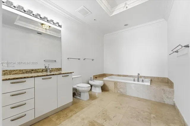 a view of a dining room with furniture and a chandelier