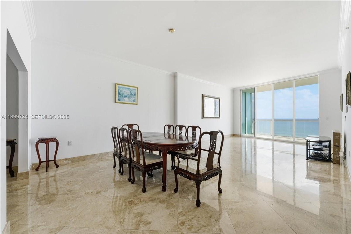 704 North Ocean Boulevard, Unit 1002 Pompano Beach, FL 33062 - Photo 26 of 57 a view of a dining room with furniture