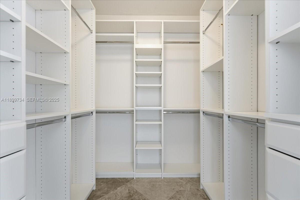 704 North Ocean Boulevard, Unit 1002 Pompano Beach, FL 33062 - Photo 34 of 57 a view of an empty walk in closet