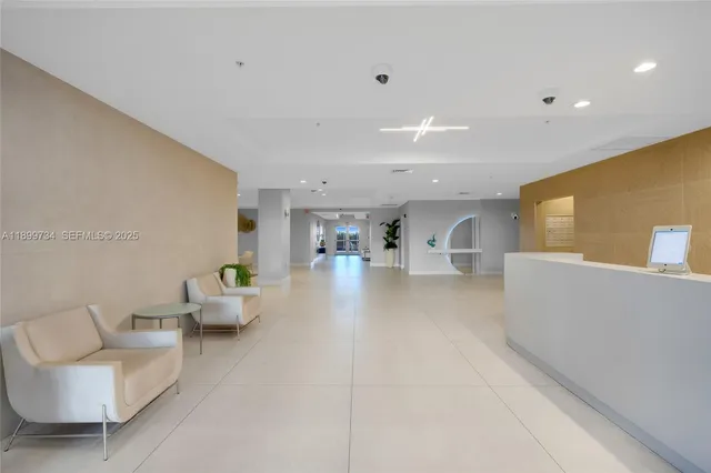 a front view of a house with a yard and palm trees