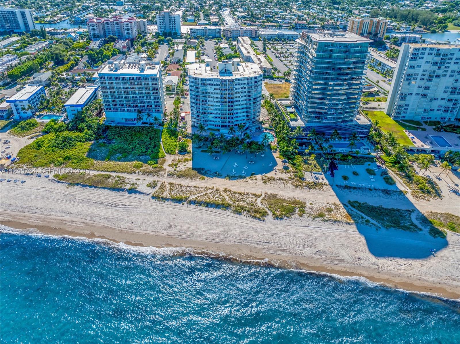 704 North Ocean Boulevard, Unit 1002 Pompano Beach, FL 33062 - Photo 52 of 57 a view of a pathway both side of building