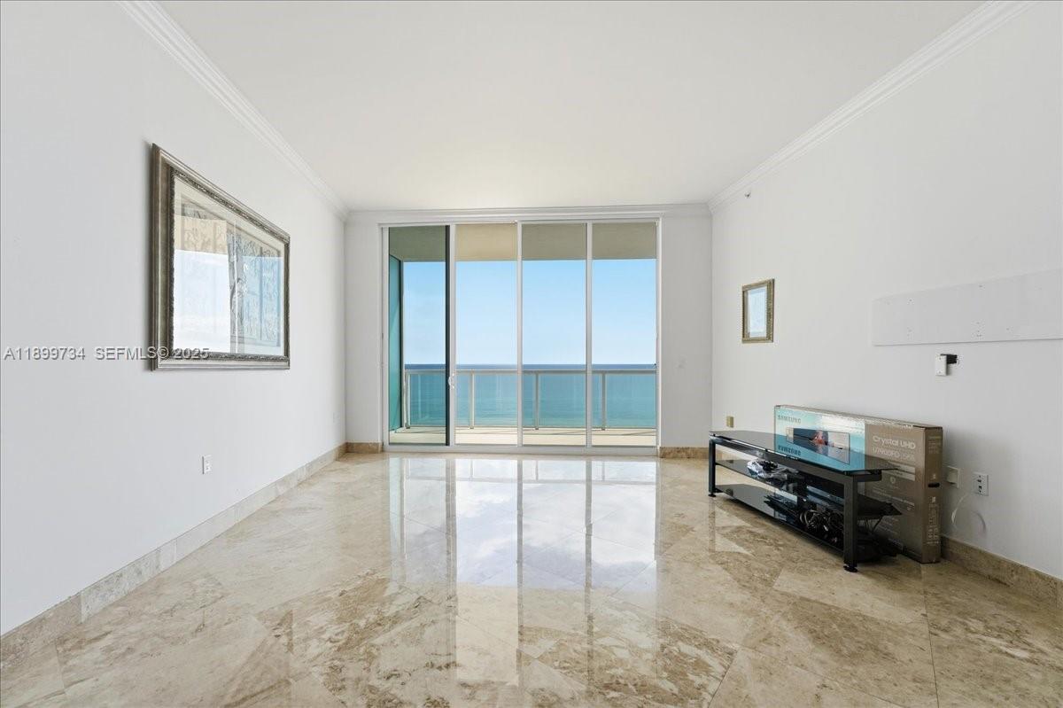 704 North Ocean Boulevard, Unit 1002 Pompano Beach, FL 33062 - Photo 6 of 57 a living room with furniture