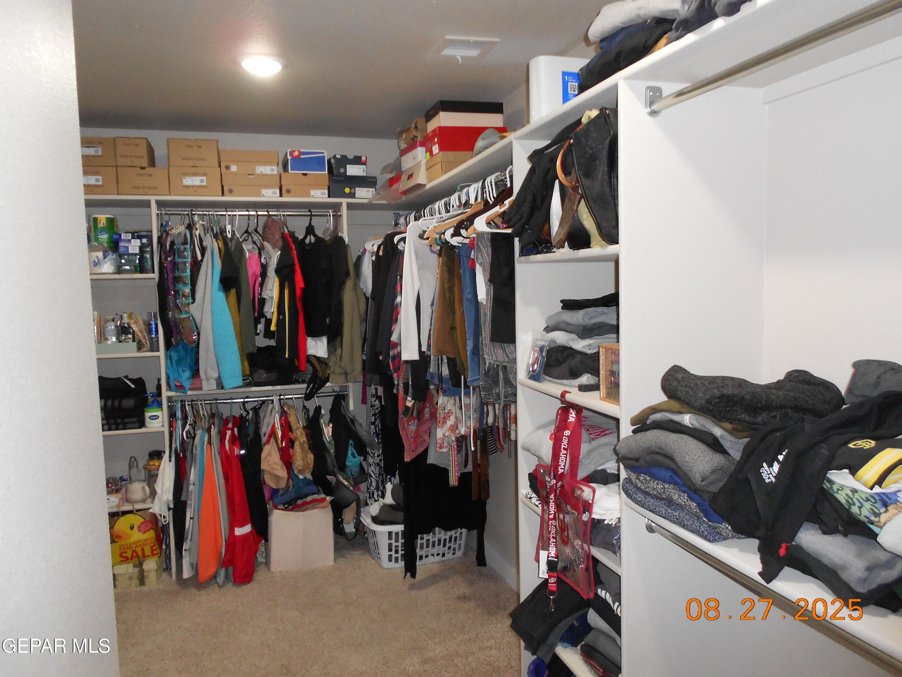 10013 Hueco Jct Road Socorro, TX 79927 - Photo 16 of 28 a view of walk in closet with clothes