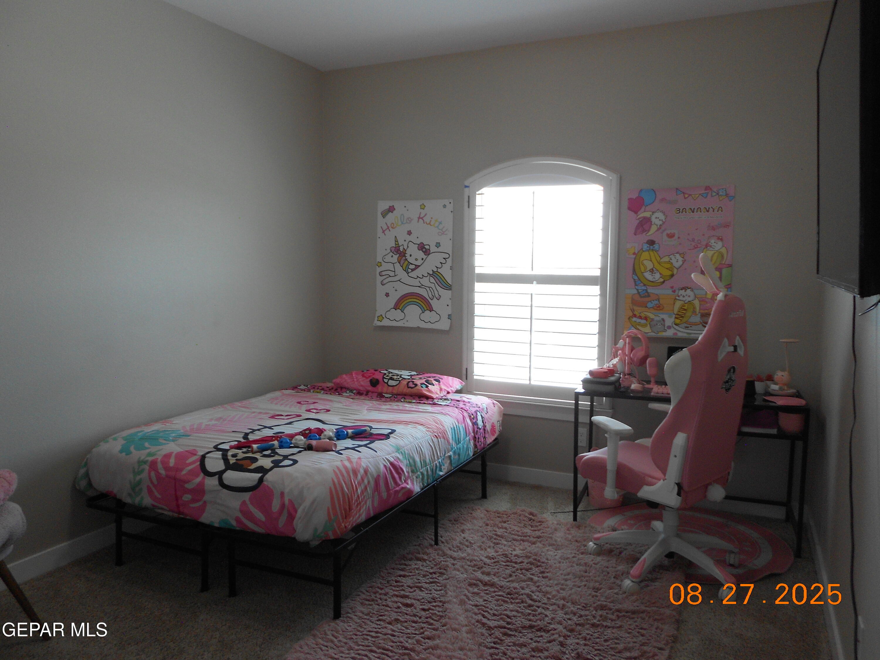 10013 Hueco Jct Road Socorro, TX 79927 - Photo 20 of 28 a bedroom with bed and a window