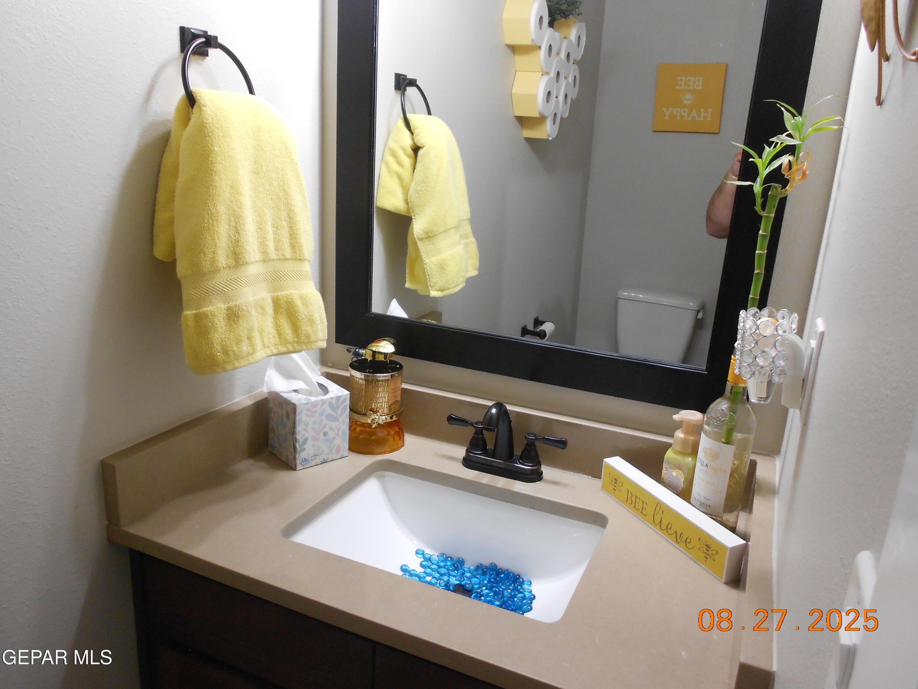 10013 Hueco Jct Road Socorro, TX 79927 - Photo 25 of 28 a bathroom with a sink and a mirror
