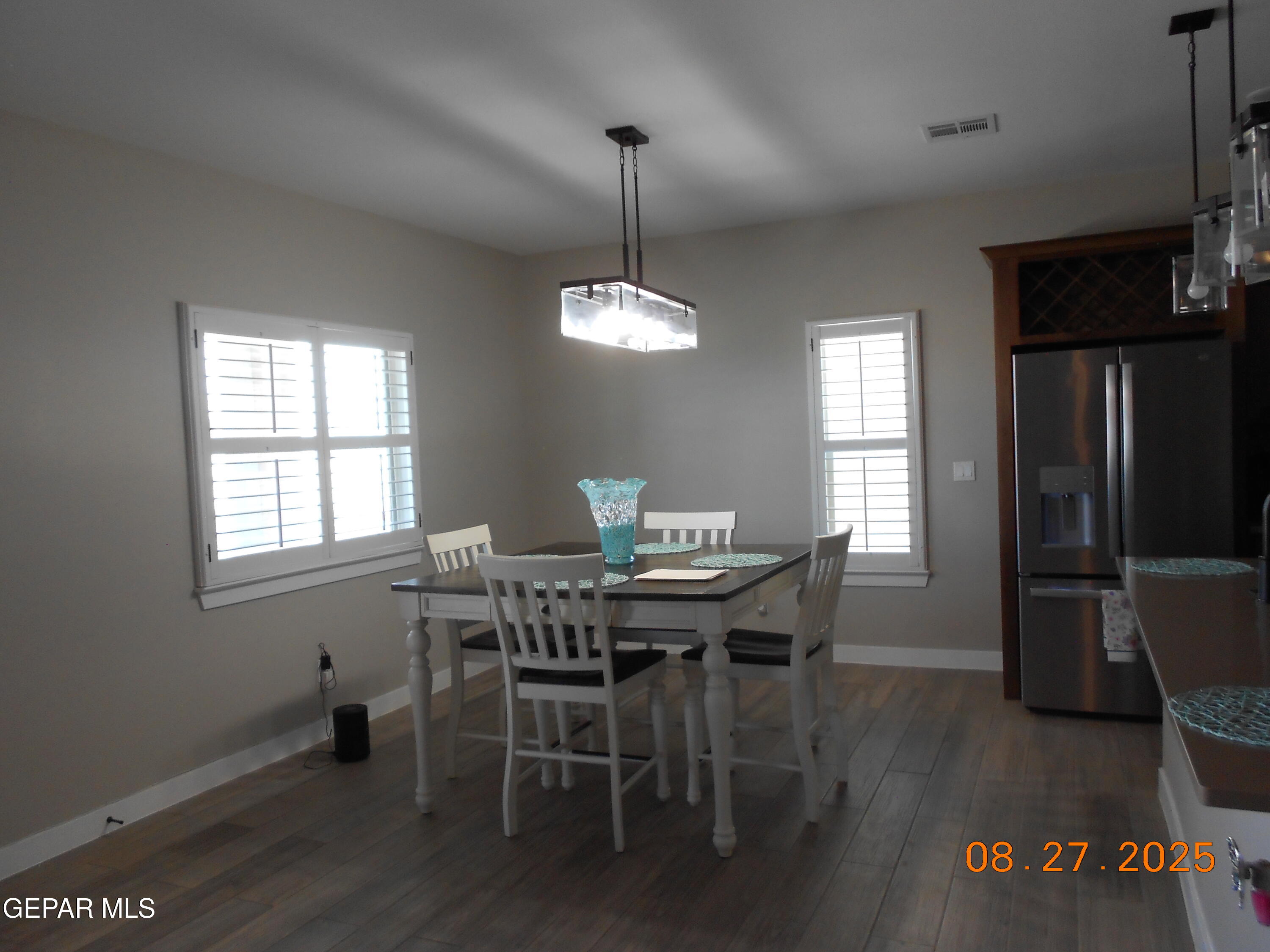 10013 Hueco Jct Road Socorro, TX 79927 - Photo 7 of 28 a dining room with furniture window wooden floor