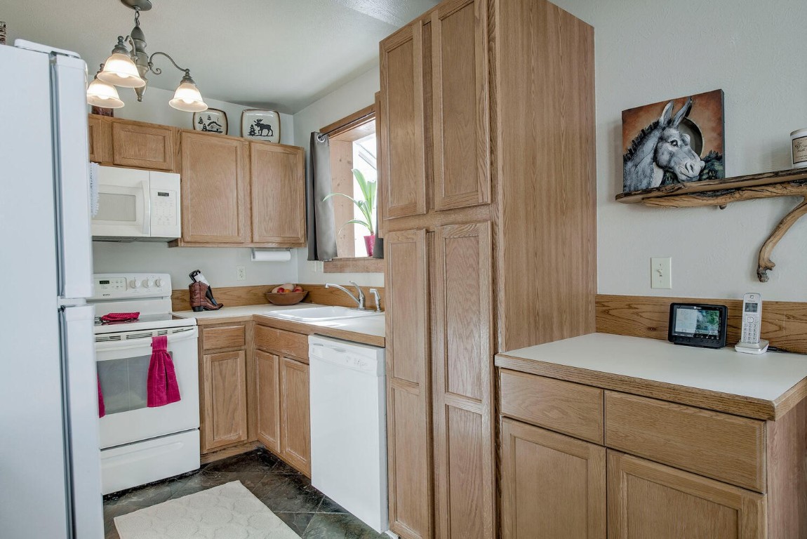 1462 Sheep Ridge Road Fairplay, CO 80440 - Photo 16 of 48 a utility room with cabinets washer and dryer