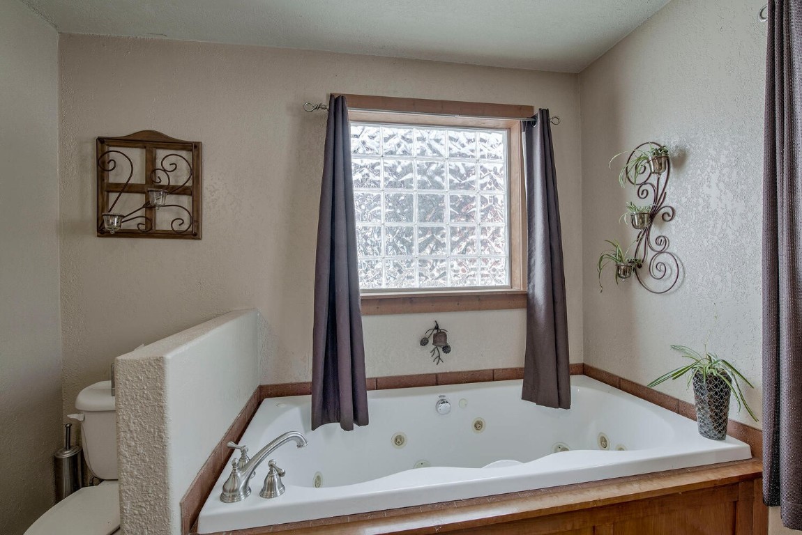 1462 Sheep Ridge Road Fairplay, CO 80440 - Photo 22 of 48 a bathroom with a bathtub and a sink