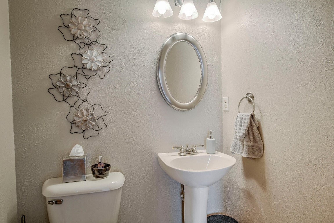 1462 Sheep Ridge Road Fairplay, CO 80440 - Photo 29 of 48 a bathroom with a toilet sink and mirror