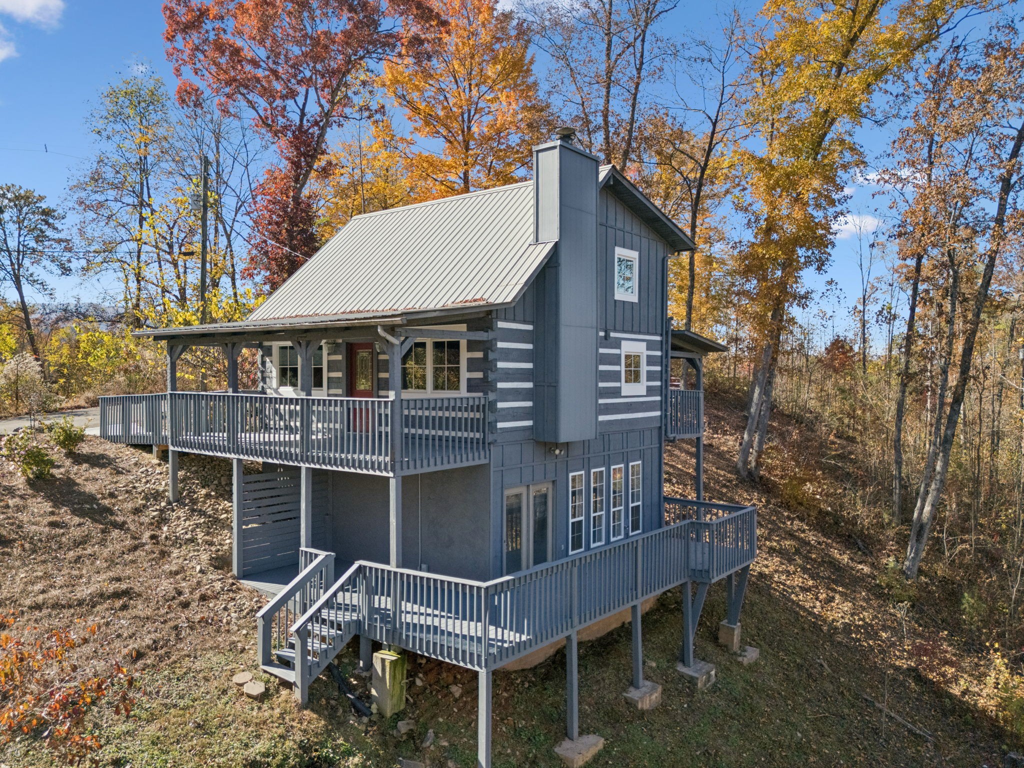 306 Beech Ridge Lane Gatlinburg, TN 37738 - Photo 1 of 24 a roof deck with table and chairs