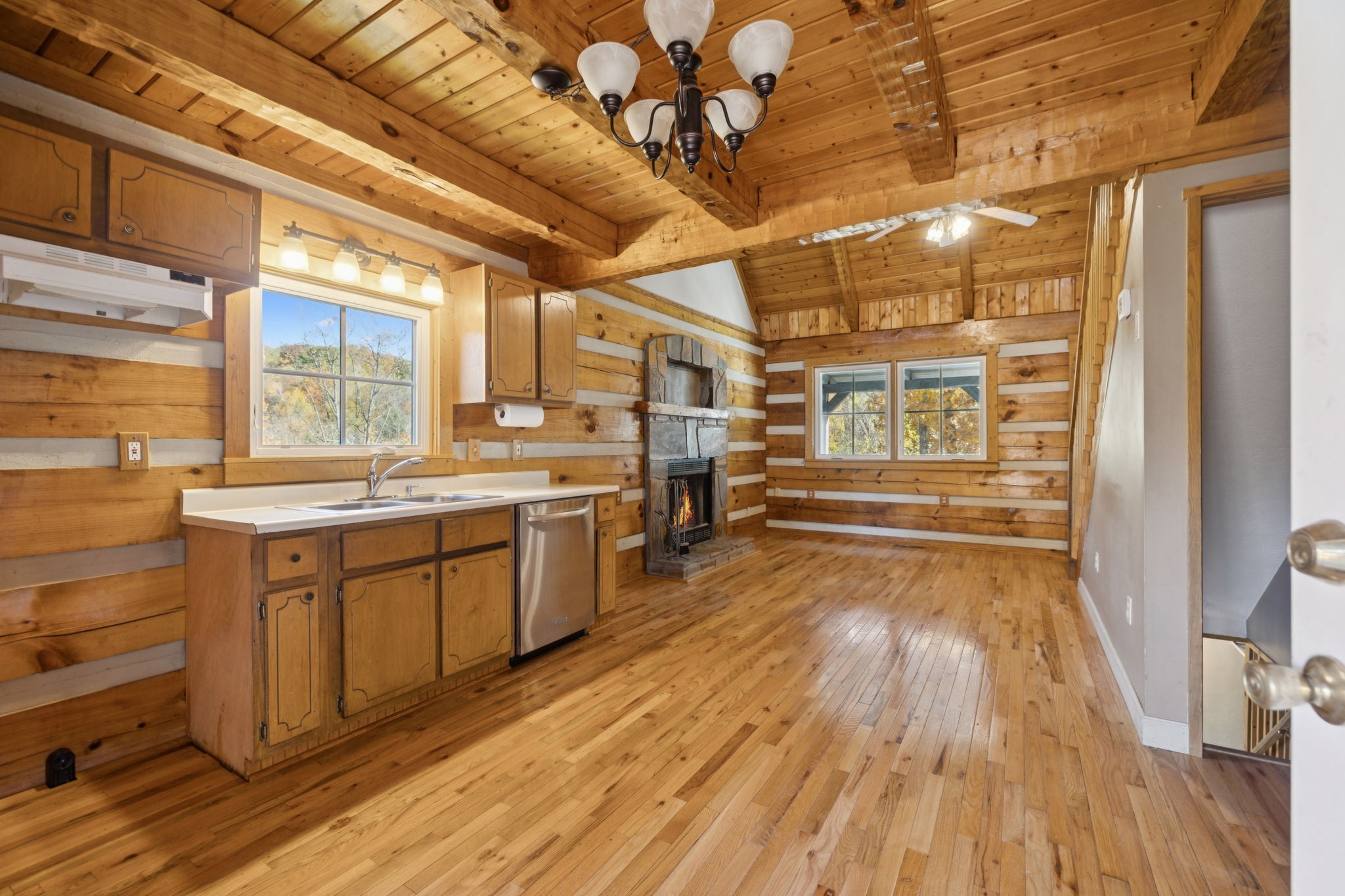 306 Beech Ridge Lane Gatlinburg, TN 37738 - Photo 14 of 24 a large kitchen with a wooden floor and cabinets