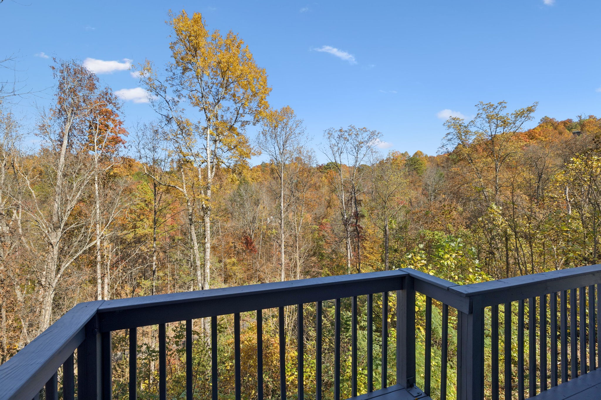 306 Beech Ridge Lane Gatlinburg, TN 37738 - Photo 9 of 24 a view of a balcony with wooden fence and floor