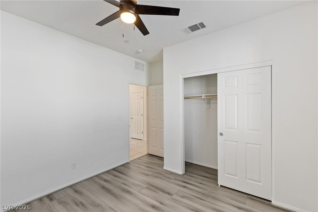 6227 Runestone Street Las Vegas, NV 89113 - Photo 23 of 33 This spacious bedroom offers comfortable living with ample storage and inviting flooring.