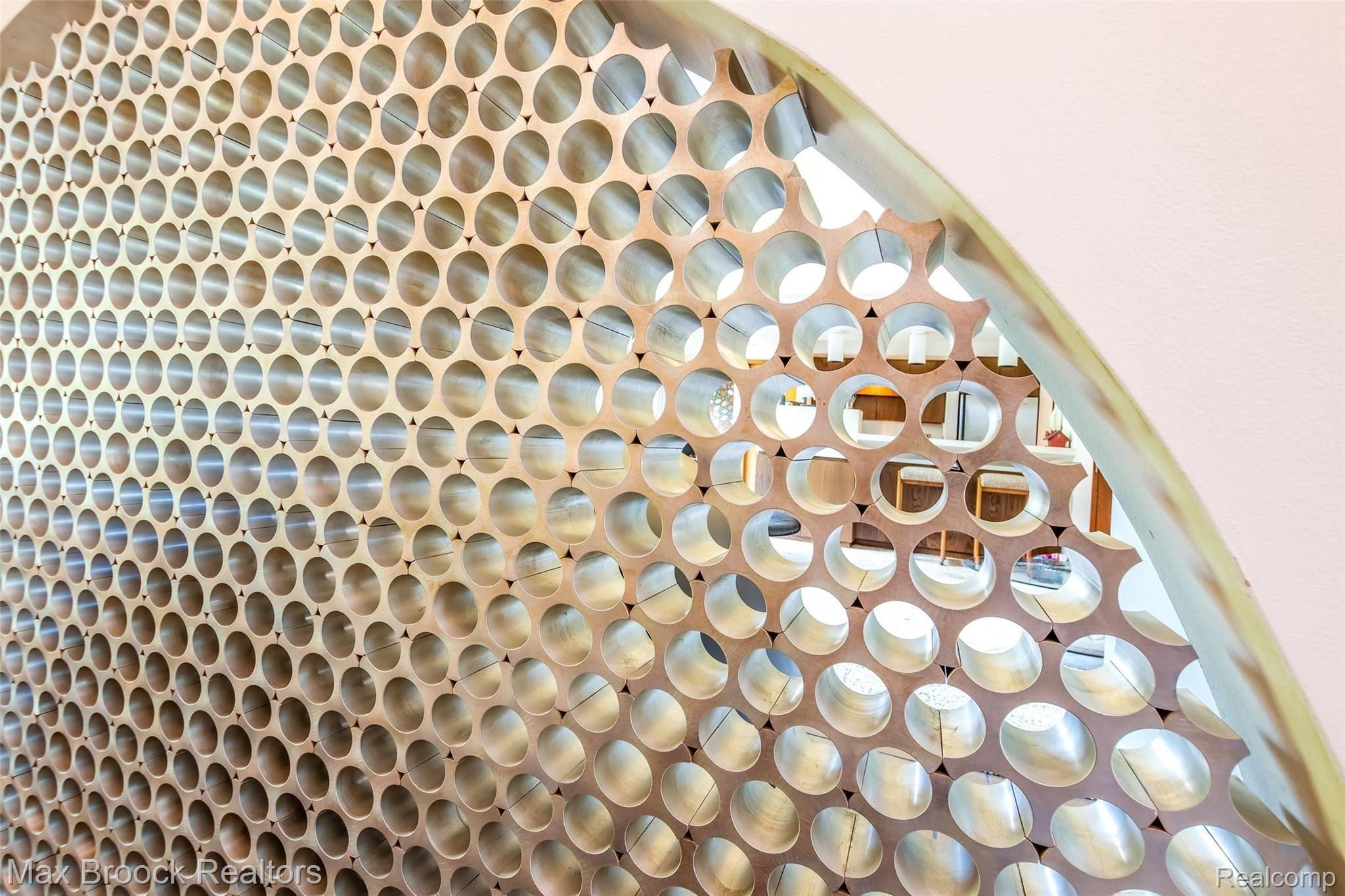 5724 North Livernois Road Rochester, MI 48306 - Photo 11 of 52 Close up of metal screen between fireplace and hallway.