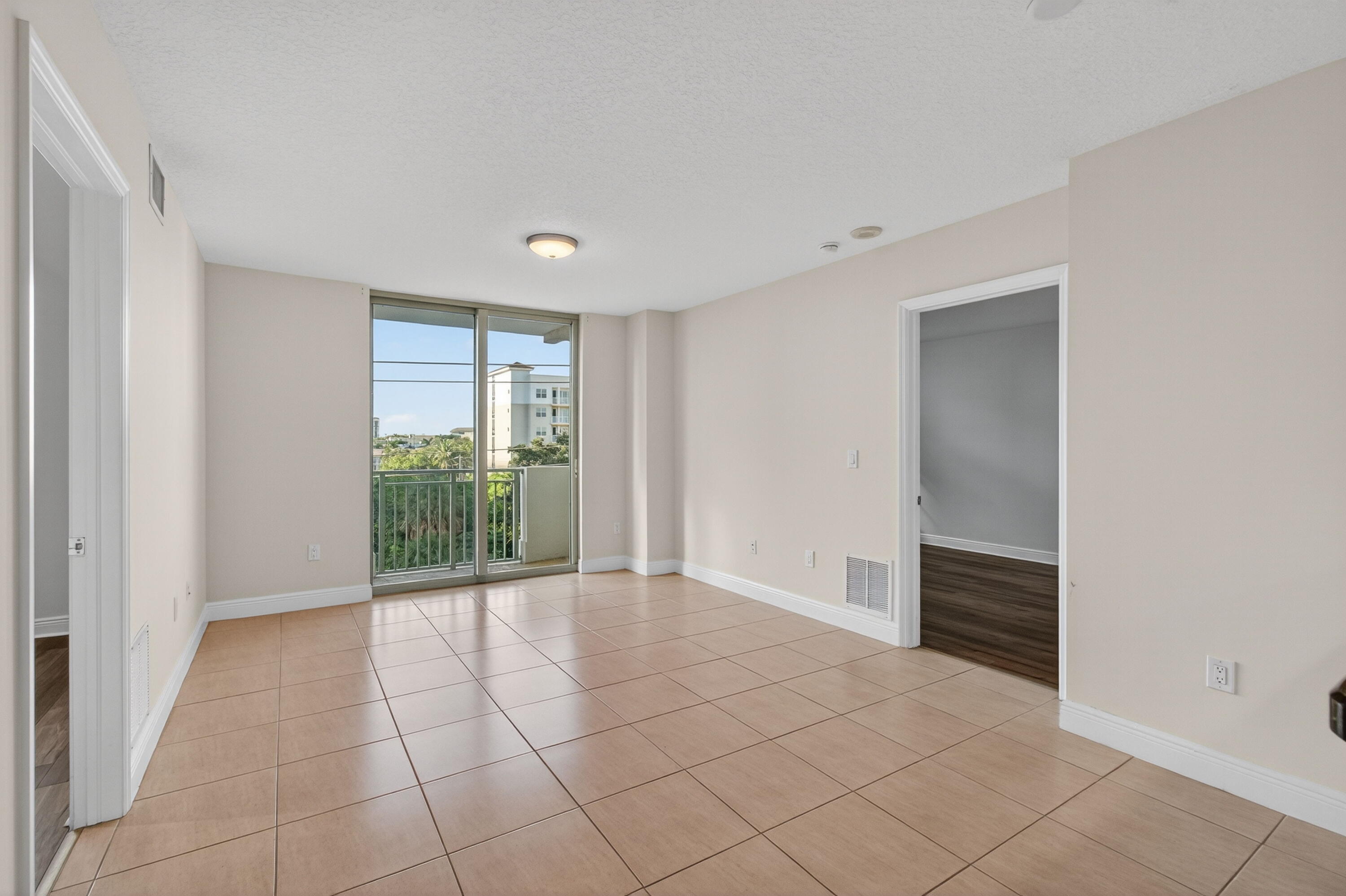 610 Clematis Street, Unit 532 West Palm Beach, FL 33401 - Photo 12 of 63 a view of an empty room with a window