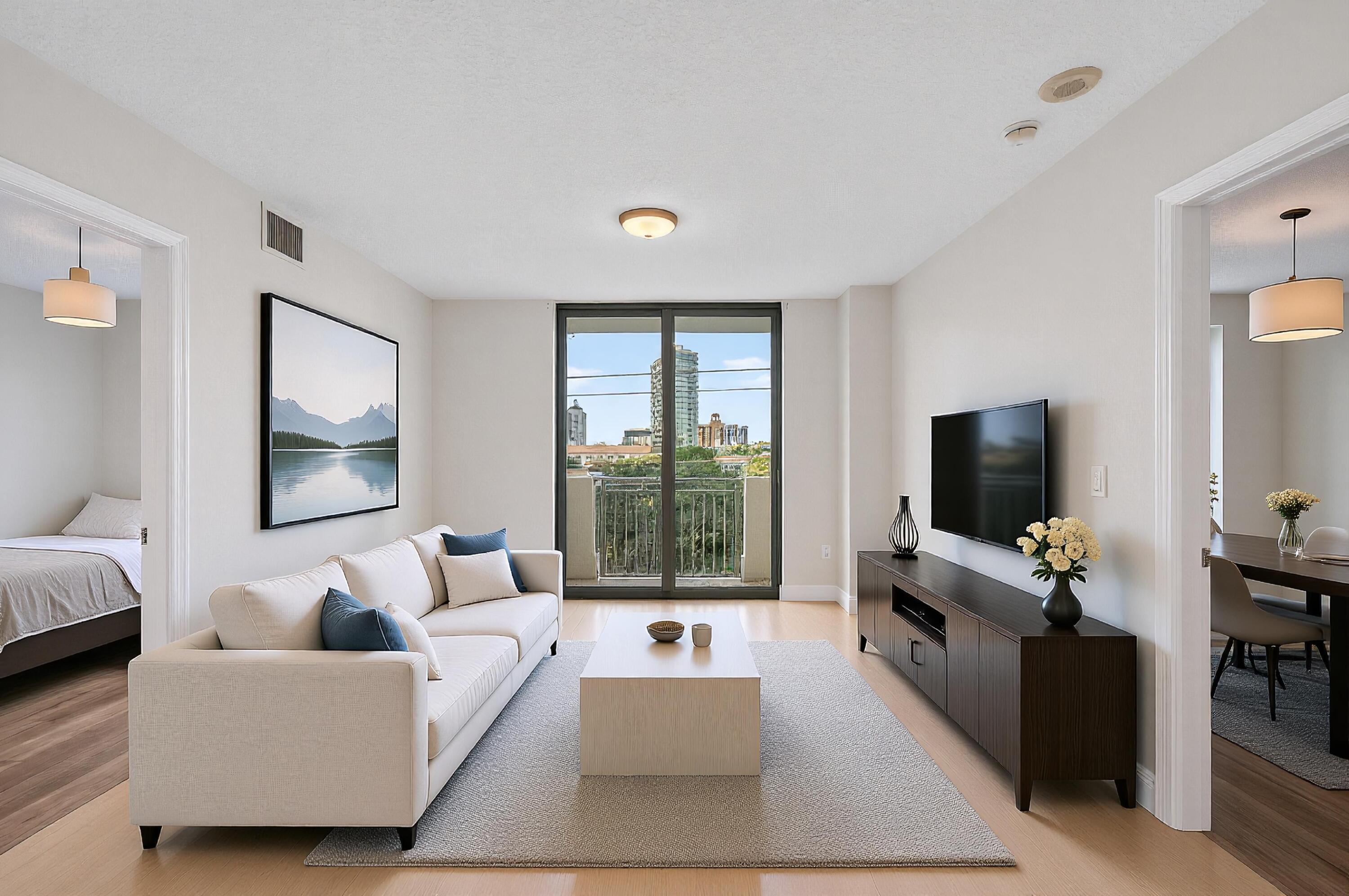 610 Clematis Street, Unit 532 West Palm Beach, FL 33401 - Photo 14 of 63 a living room with furniture and a flat screen tv