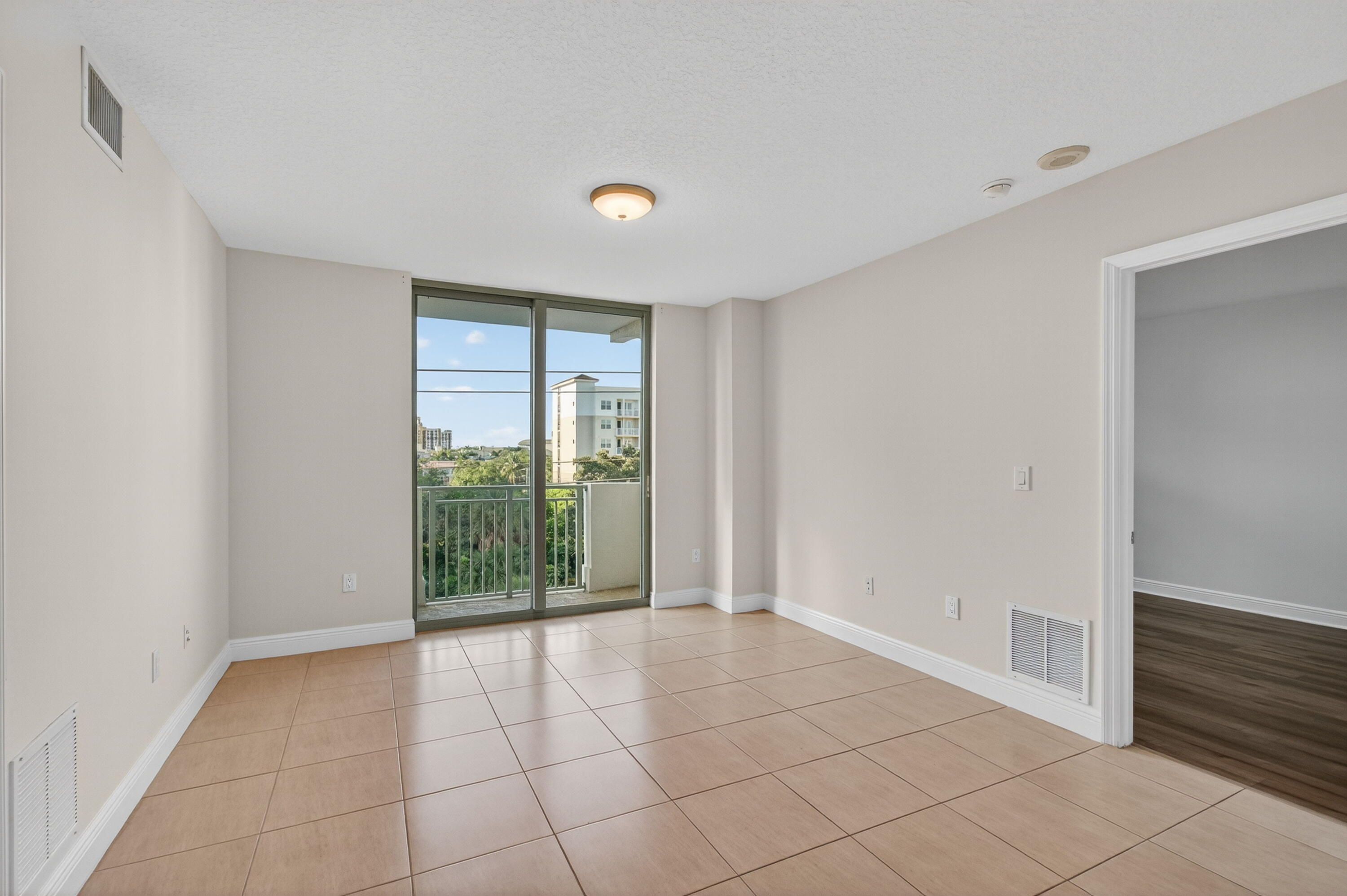 610 Clematis Street, Unit 532 West Palm Beach, FL 33401 - Photo 16 of 63 a view of an empty room with glass door