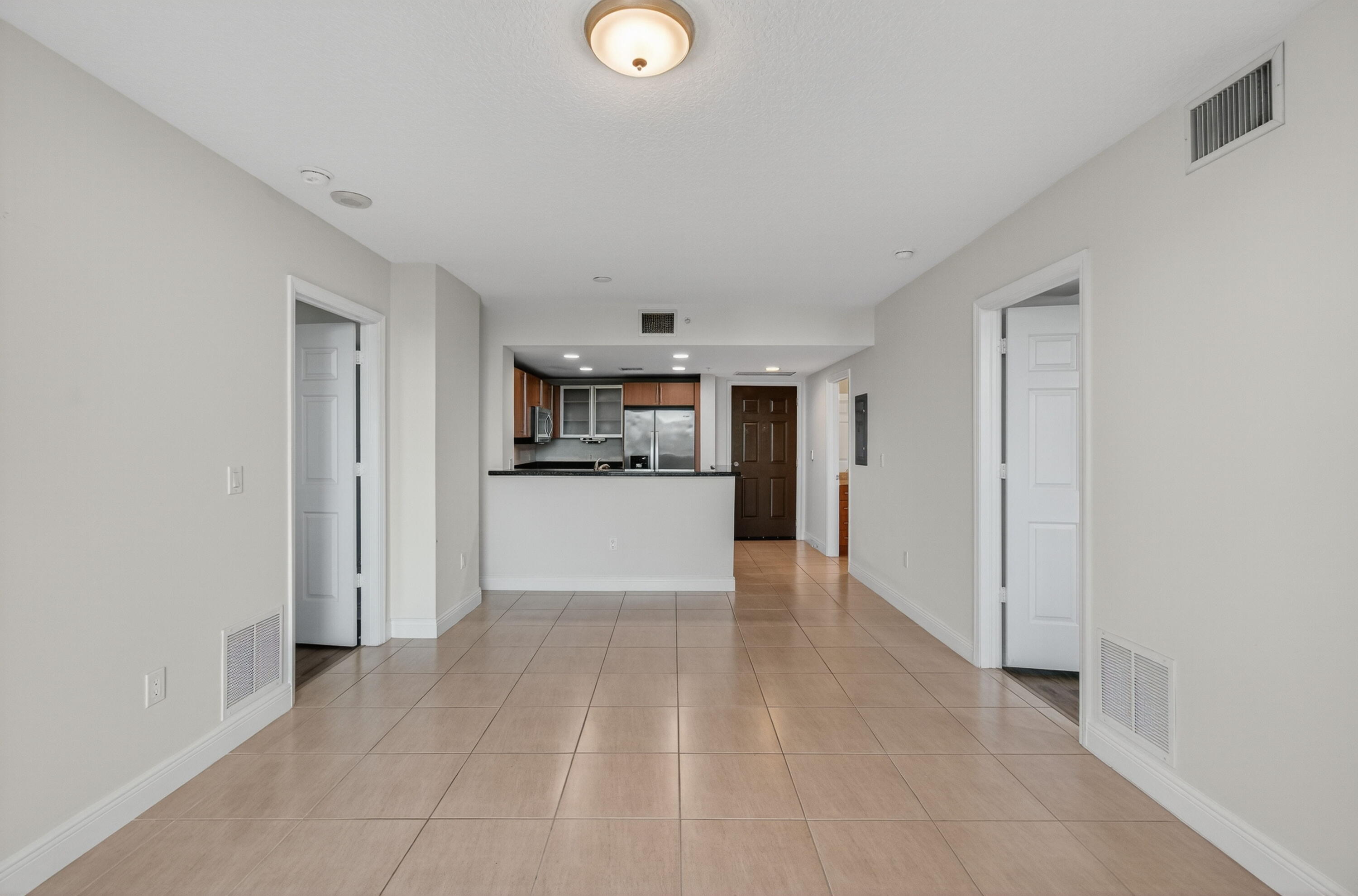 610 Clematis Street, Unit 532 West Palm Beach, FL 33401 - Photo 20 of 63 a view of a kitchen with a sink and cabinets