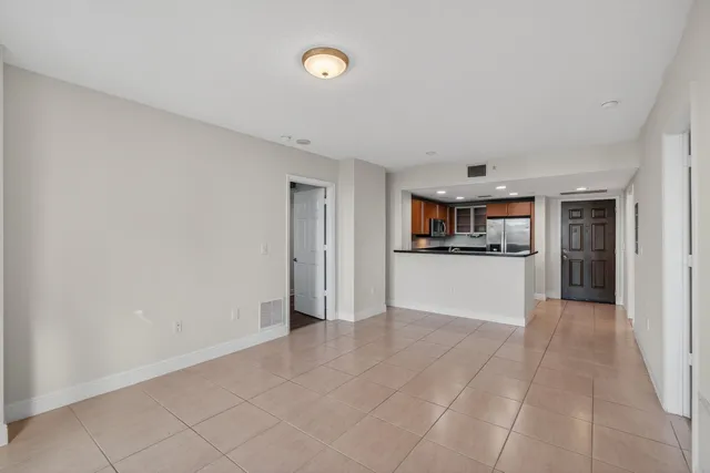 a kitchen with granite countertop a sink stove and cabinets