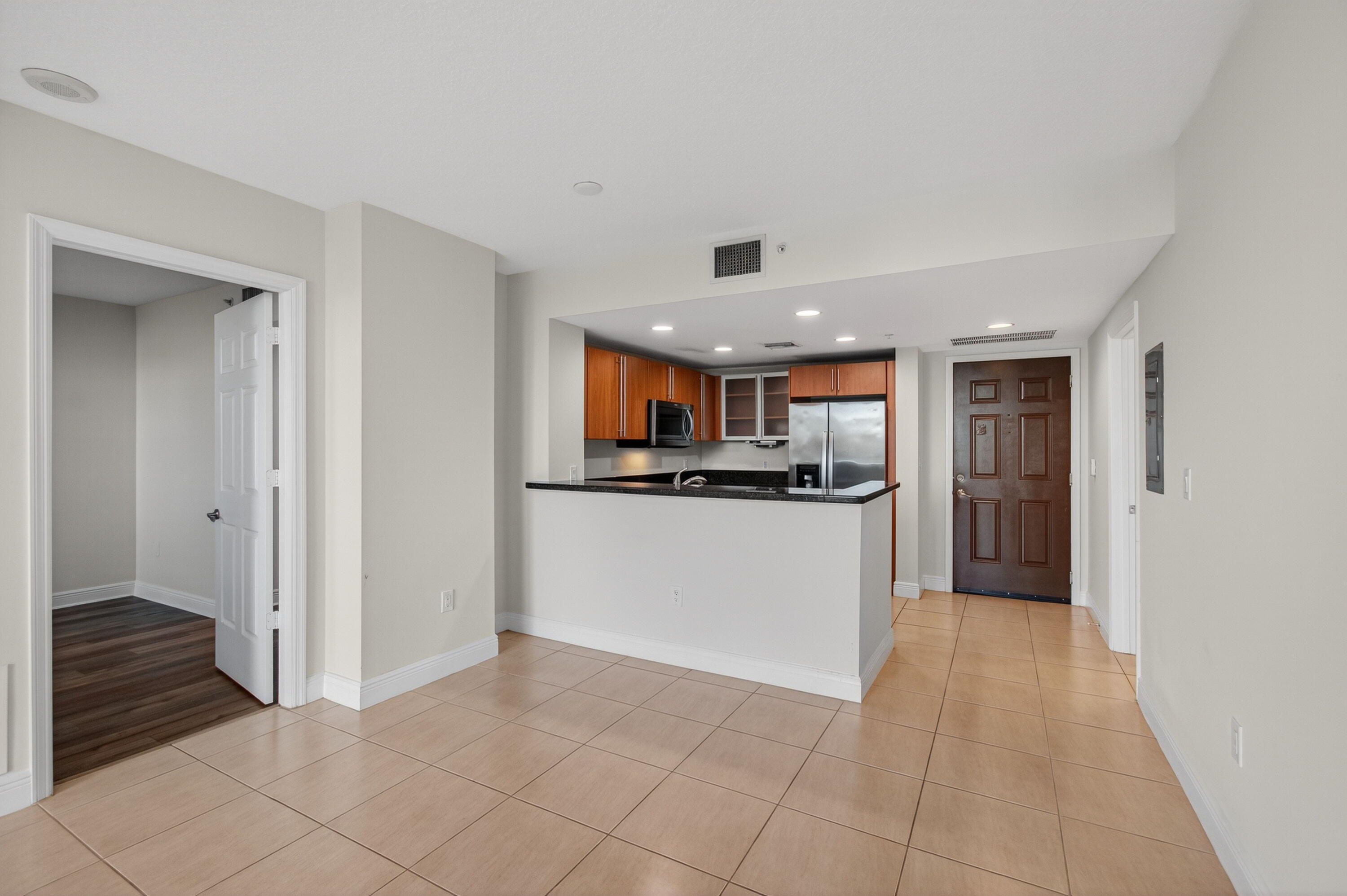 610 Clematis Street, Unit 532 West Palm Beach, FL 33401 - Photo 22 of 63 a view of kitchen with refrigerator and window