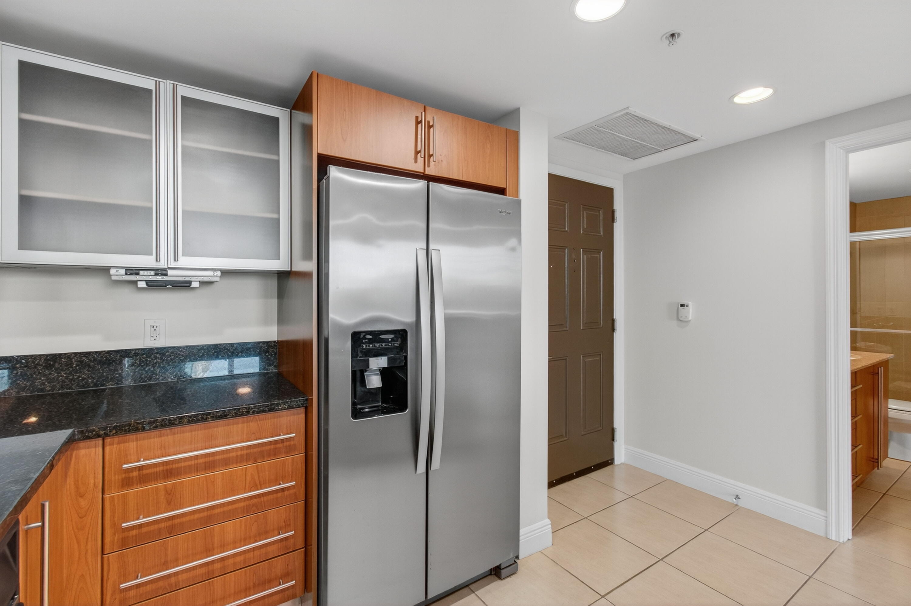 610 Clematis Street, Unit 532 West Palm Beach, FL 33401 - Photo 30 of 63 a kitchen with stainless steel appliances granite countertop a refrigerator and a sink