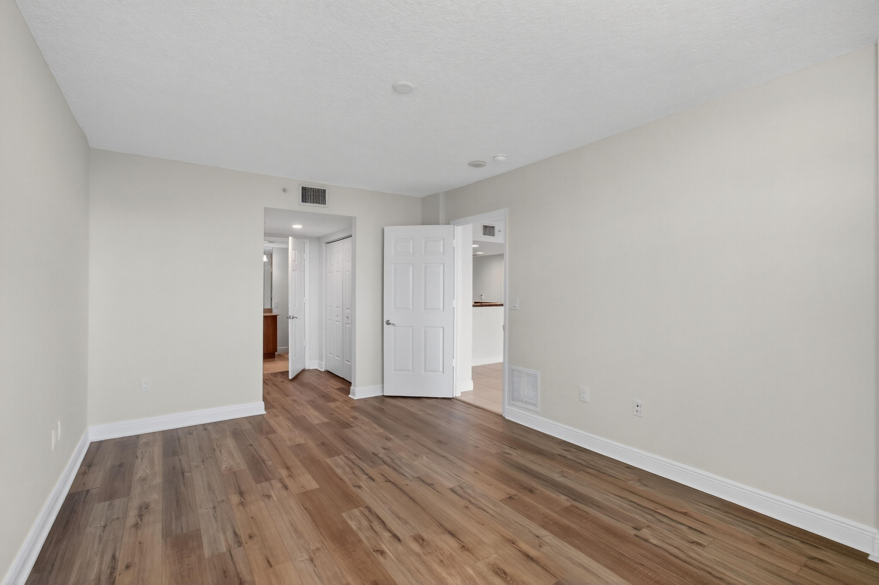 610 Clematis Street, Unit 532 West Palm Beach, FL 33401 - Photo 37 of 63 a view of an empty room with wooden floor
