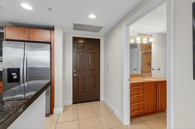 a view of an empty room with glass door