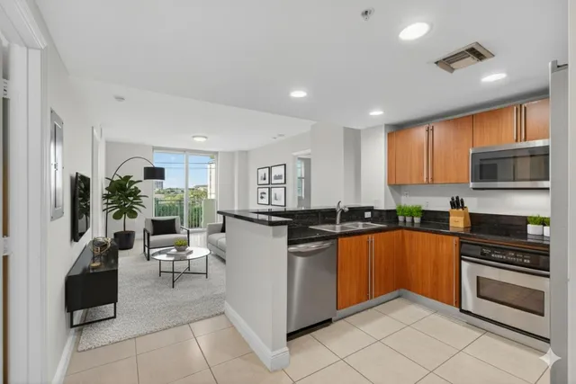 wooden floor in an empty room and a kitchen