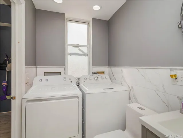 a utility room with dryer and washer